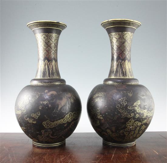 A pair of Chinese gilt and polychrome decorated black lacquer bottle vases, early 20th century, 44cm